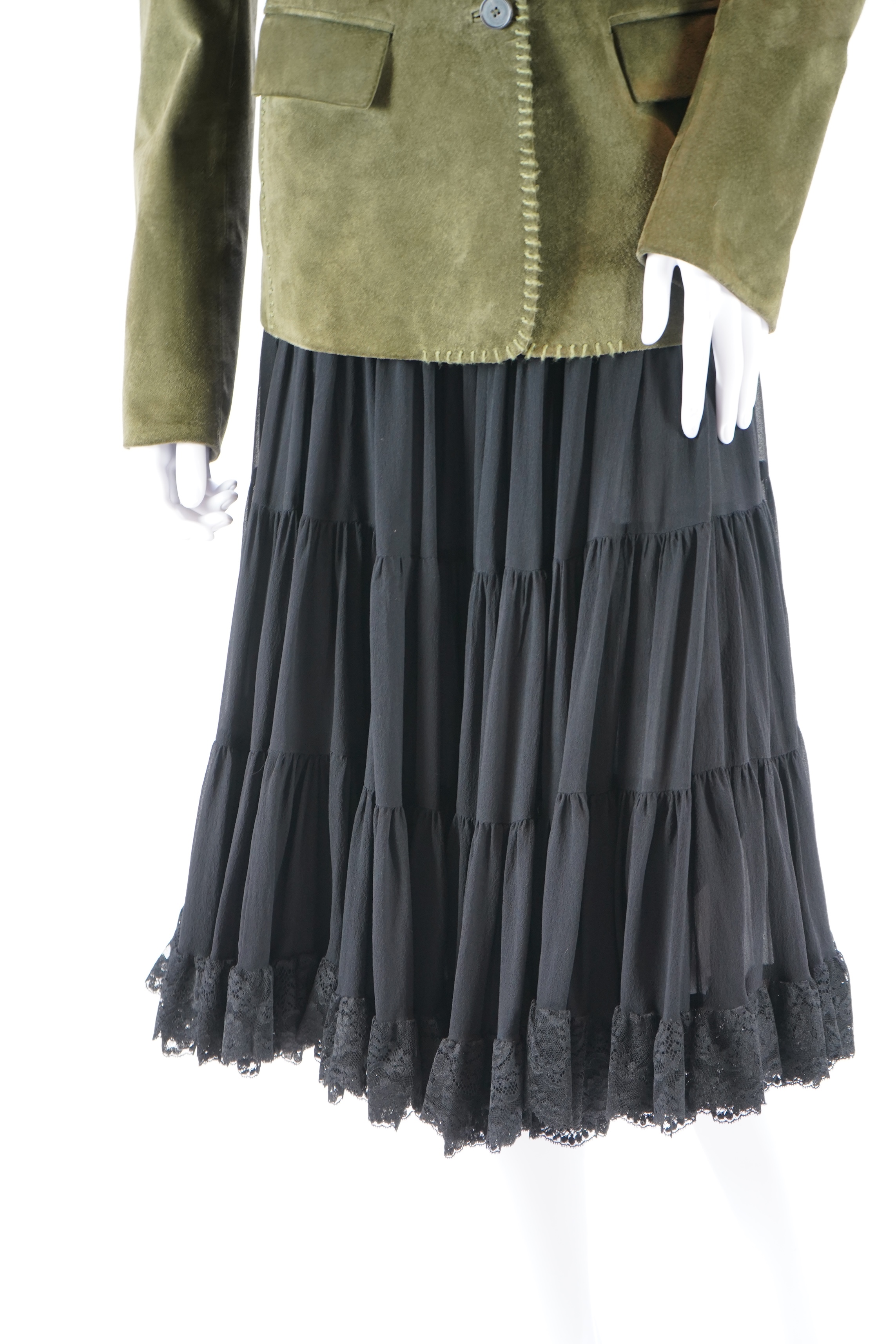 A lady's Yves Saint Laurent olive green suede jacket with stitching details and a black YSL (label missing) gypsy skirt with underskirt. IT 38 (UK size 10)